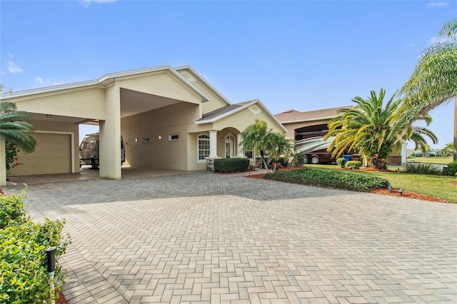 view of front of home featuring a carport and a garage