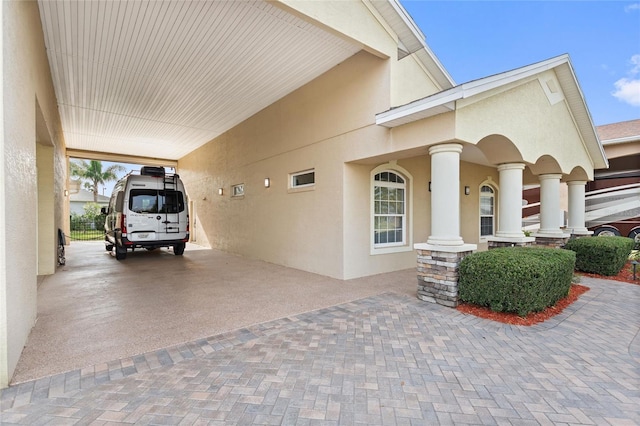 view of home's exterior with a carport