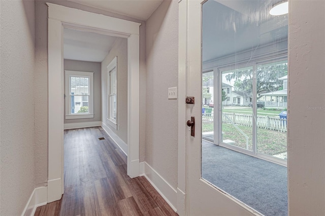 interior space with dark colored carpet