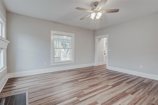 empty room featuring light hardwood / wood-style floors and ceiling fan