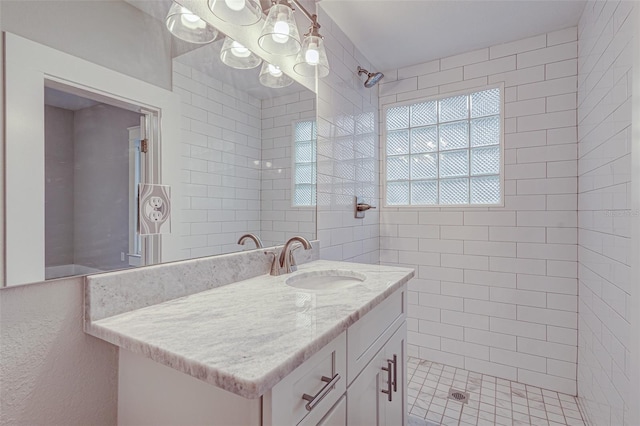 bathroom featuring vanity and a tile shower