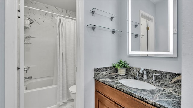 full bathroom featuring shower / tub combo with curtain, tile floors, toilet, and vanity with extensive cabinet space