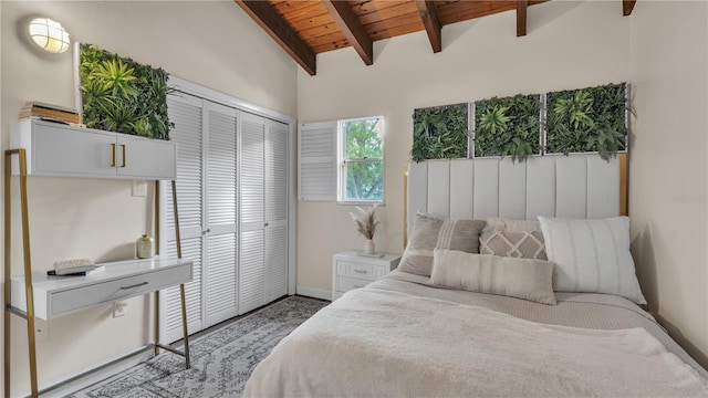 bedroom with a closet, wood ceiling, and lofted ceiling with beams