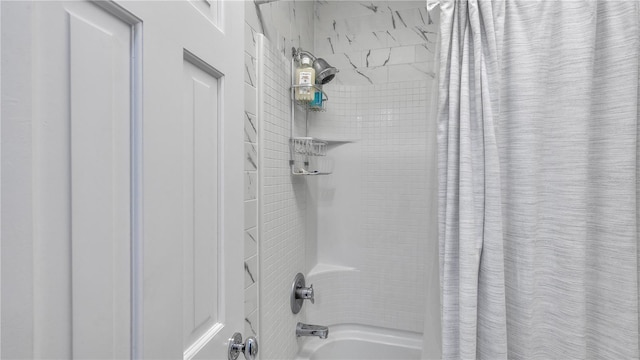 bathroom with shower / bathtub combination with curtain