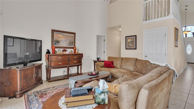 tiled living room with a high ceiling