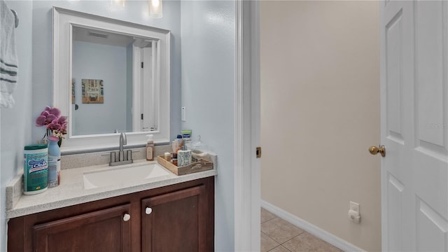 bathroom featuring tile flooring and vanity