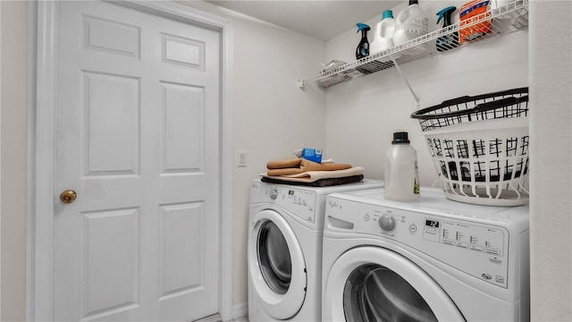 laundry area with separate washer and dryer