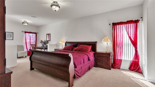 bedroom with light colored carpet