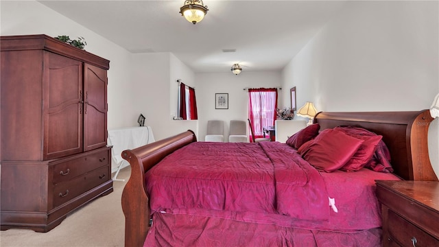 bedroom with light colored carpet