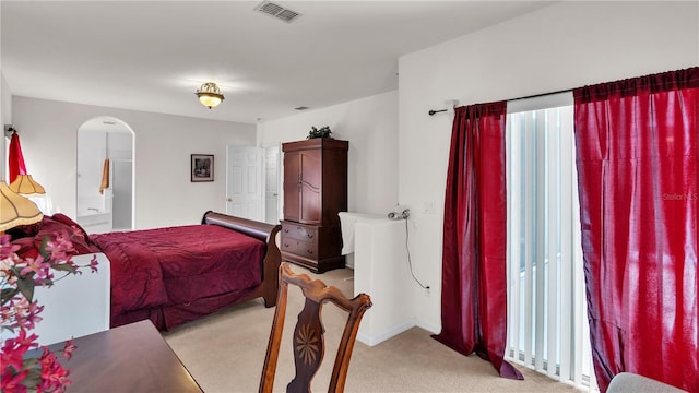 bedroom featuring light carpet