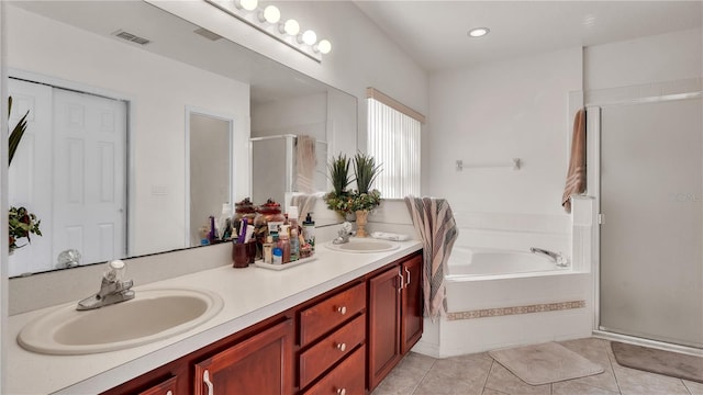 bathroom featuring plus walk in shower, tile floors, and dual bowl vanity