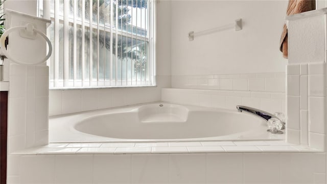 bathroom featuring tiled bath