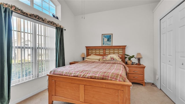 carpeted bedroom featuring a closet