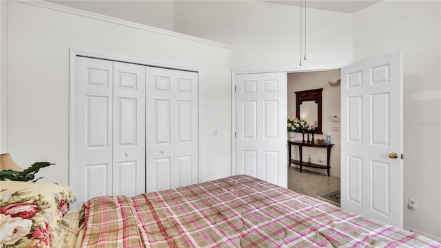 unfurnished bedroom featuring dark carpet and a closet