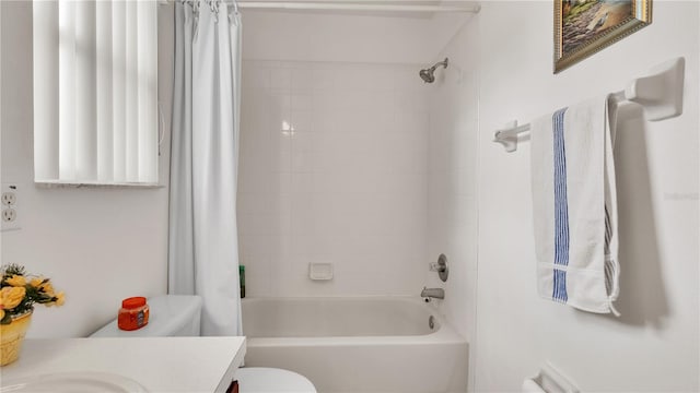 full bathroom with shower / tub combo, vanity, and toilet