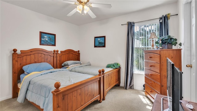 bedroom with light colored carpet and ceiling fan