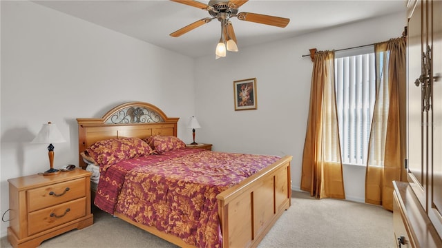 bedroom featuring light colored carpet and ceiling fan