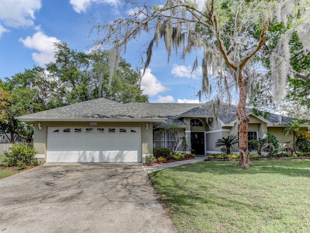 ranch-style home featuring a front lawn and a garage