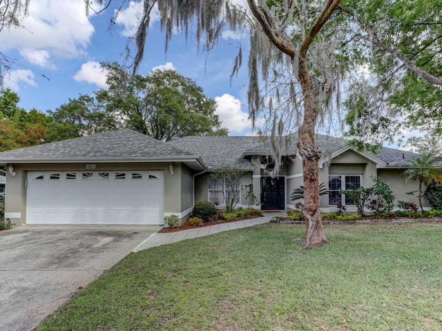 ranch-style home with a front yard and a garage