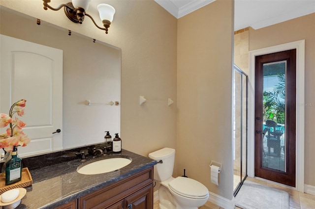 bathroom featuring toilet, a notable chandelier, vanity, walk in shower, and crown molding