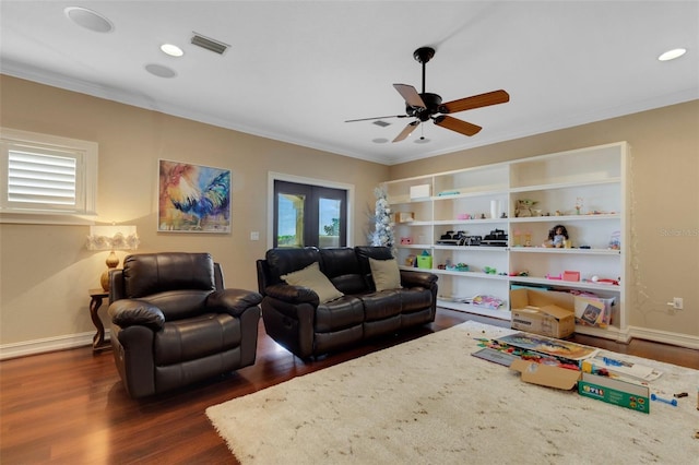 living room with dark hardwood / wood-style flooring, ceiling fan, french doors, and a wealth of natural light