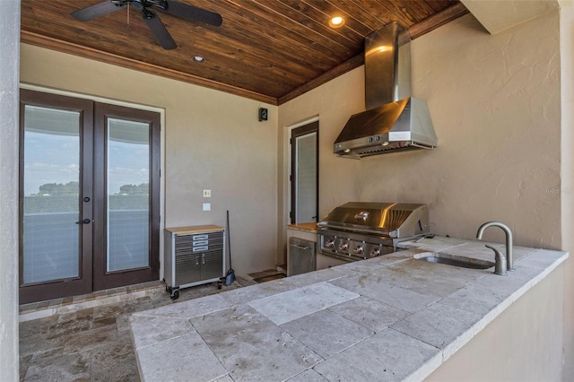 exterior space featuring exterior kitchen, ceiling fan, grilling area, and sink