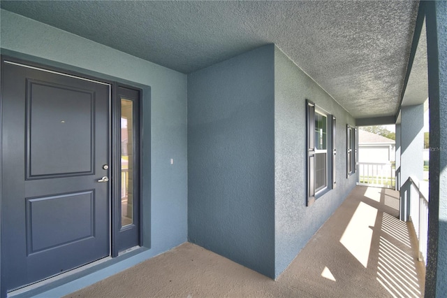 entrance to property with a porch