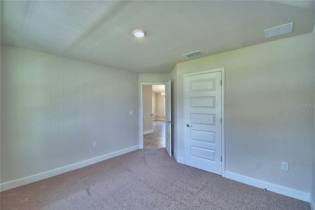 unfurnished room with carpet flooring