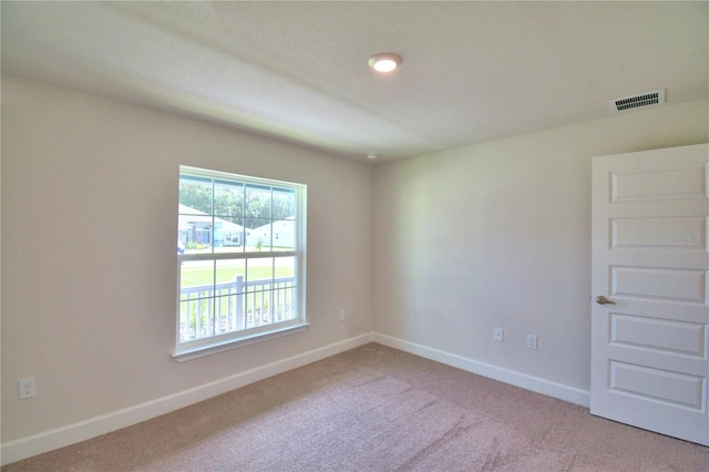 view of carpeted spare room