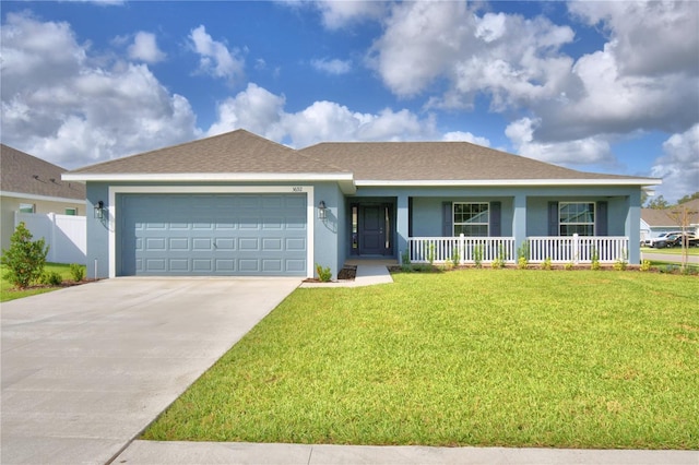 single story home with a front yard, a porch, and a garage