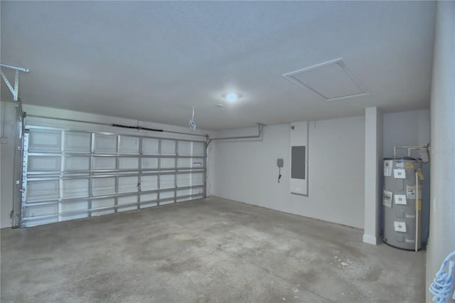 garage featuring electric water heater and electric panel