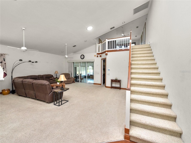 living room with ceiling fan, light carpet, and high vaulted ceiling