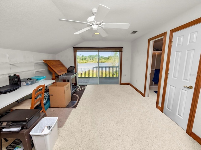 office area featuring ceiling fan, carpet flooring, and vaulted ceiling