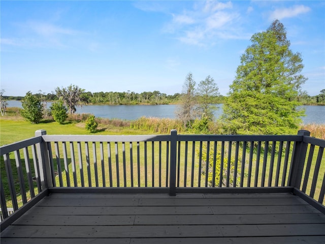 wooden deck featuring a water view and a yard