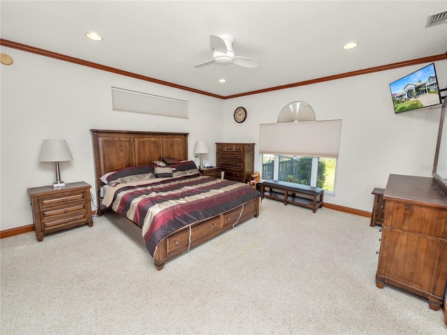 carpeted bedroom with ceiling fan and crown molding