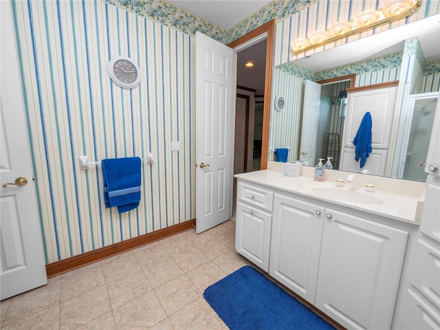 bathroom featuring tile floors and vanity