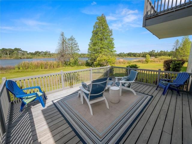 wooden deck featuring a water view