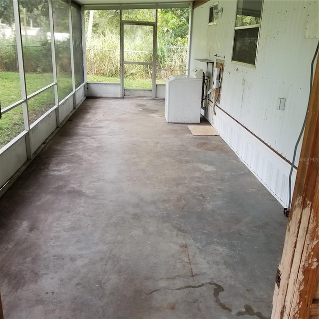 unfurnished sunroom with washer / dryer