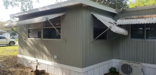 view of property exterior with ac unit