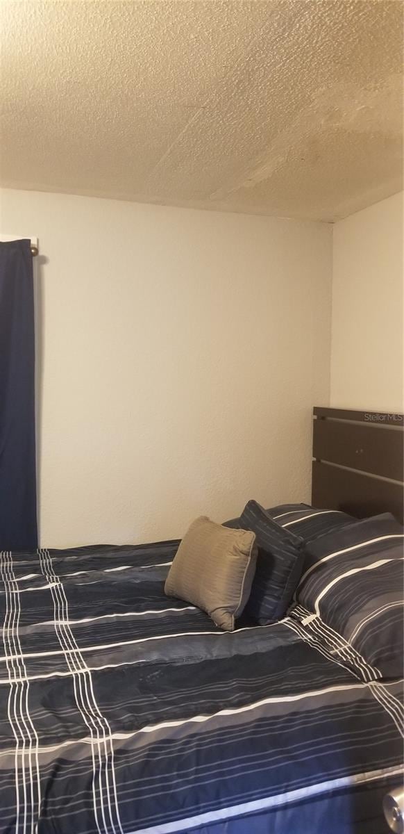 bedroom featuring a textured ceiling