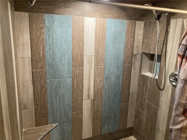 bathroom with tiled shower