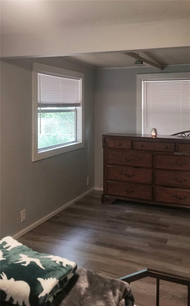 unfurnished bedroom featuring dark hardwood / wood-style flooring