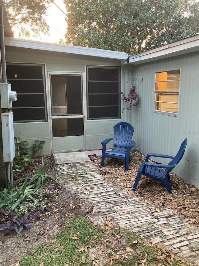 view of patio / terrace with a sunroom