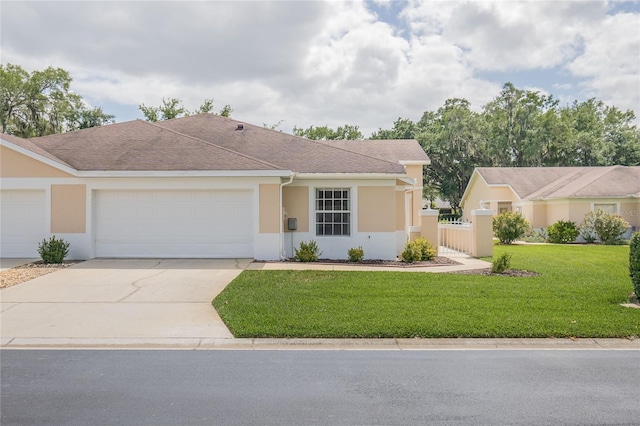 single story home with a front lawn and a garage