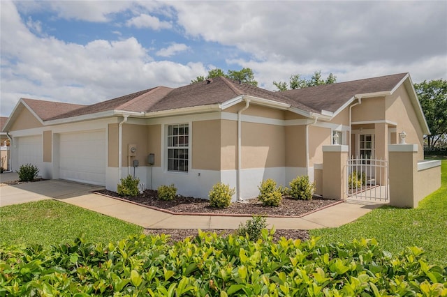 ranch-style house featuring a front lawn and a garage