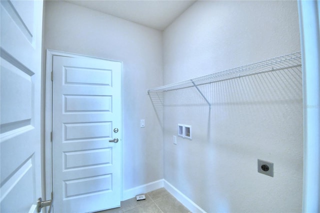 laundry room with hookup for an electric dryer, light tile patterned floors, and hookup for a washing machine