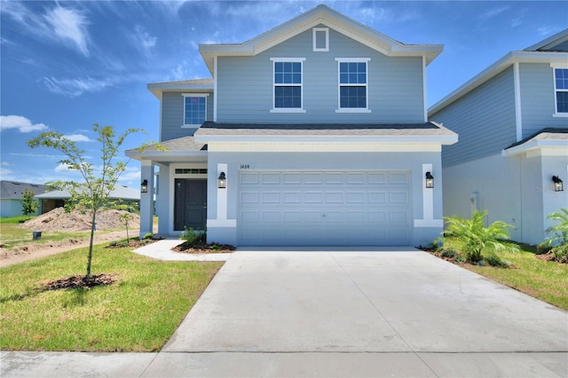 front facade with a front yard and a garage