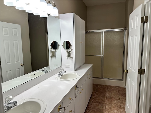 bathroom with walk in shower, tile floors, and dual vanity