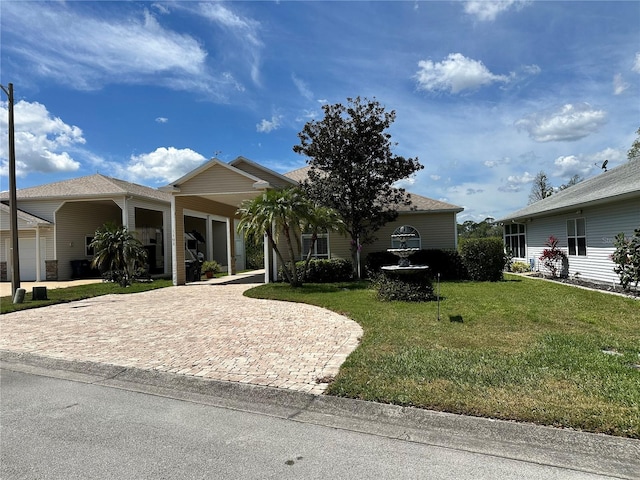 view of front of property featuring a garage and a front yard