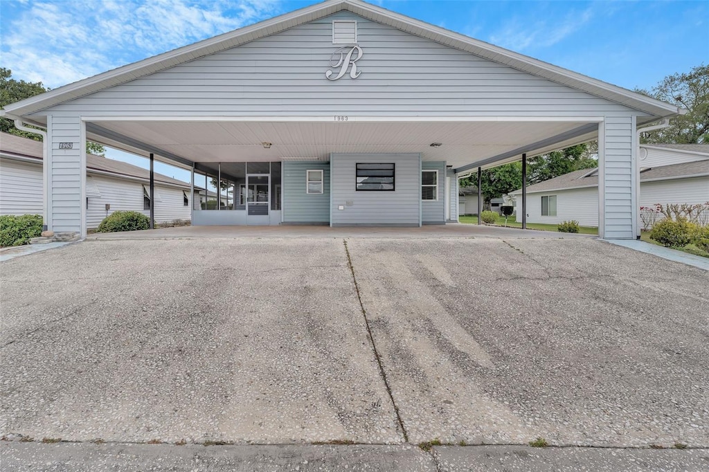 view of front of property featuring a carport